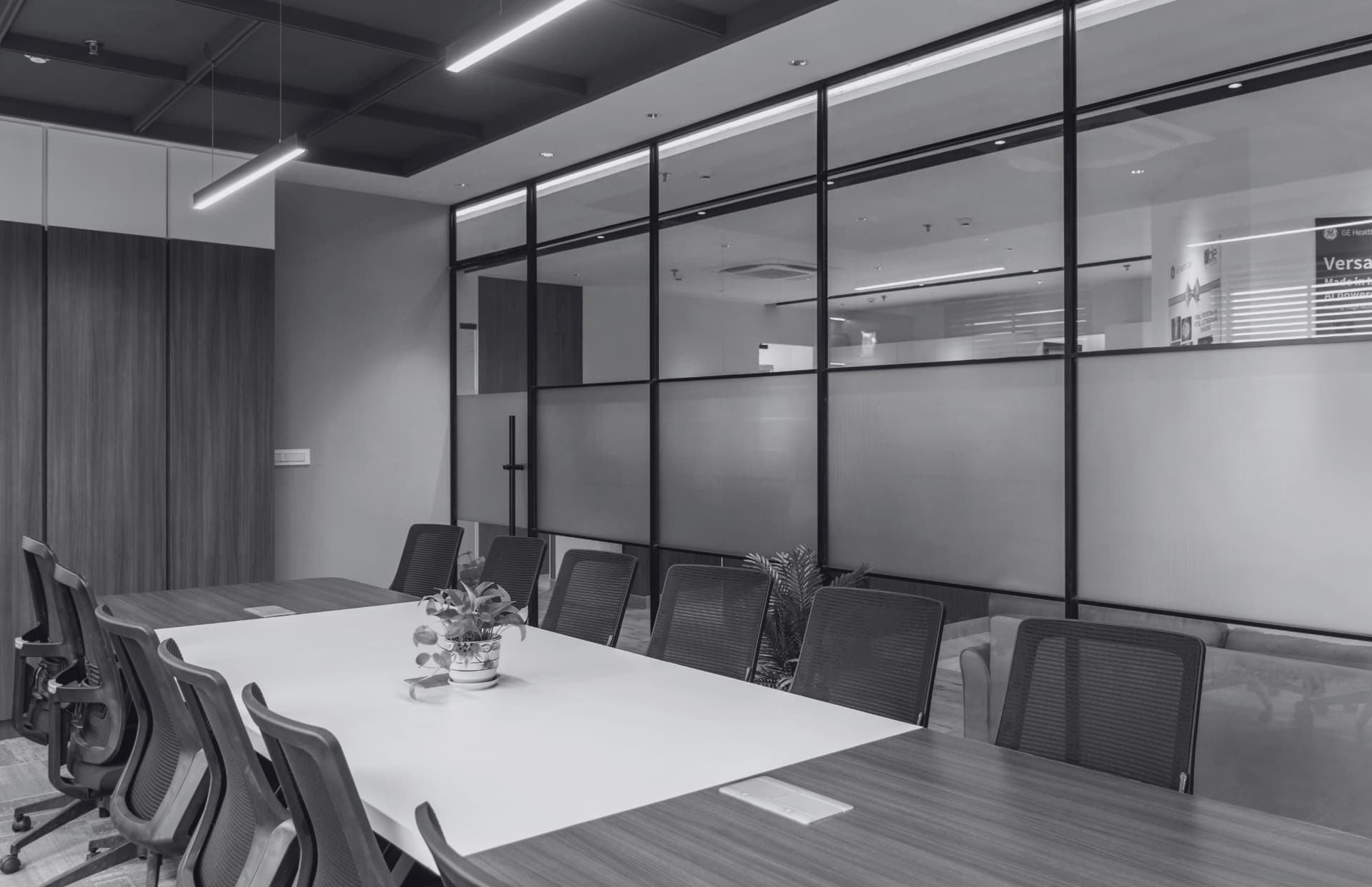 Clean, empty boardroom with glass partition walls in a commercial office